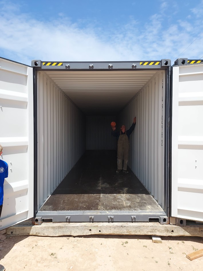 Steel container doors open — interior view