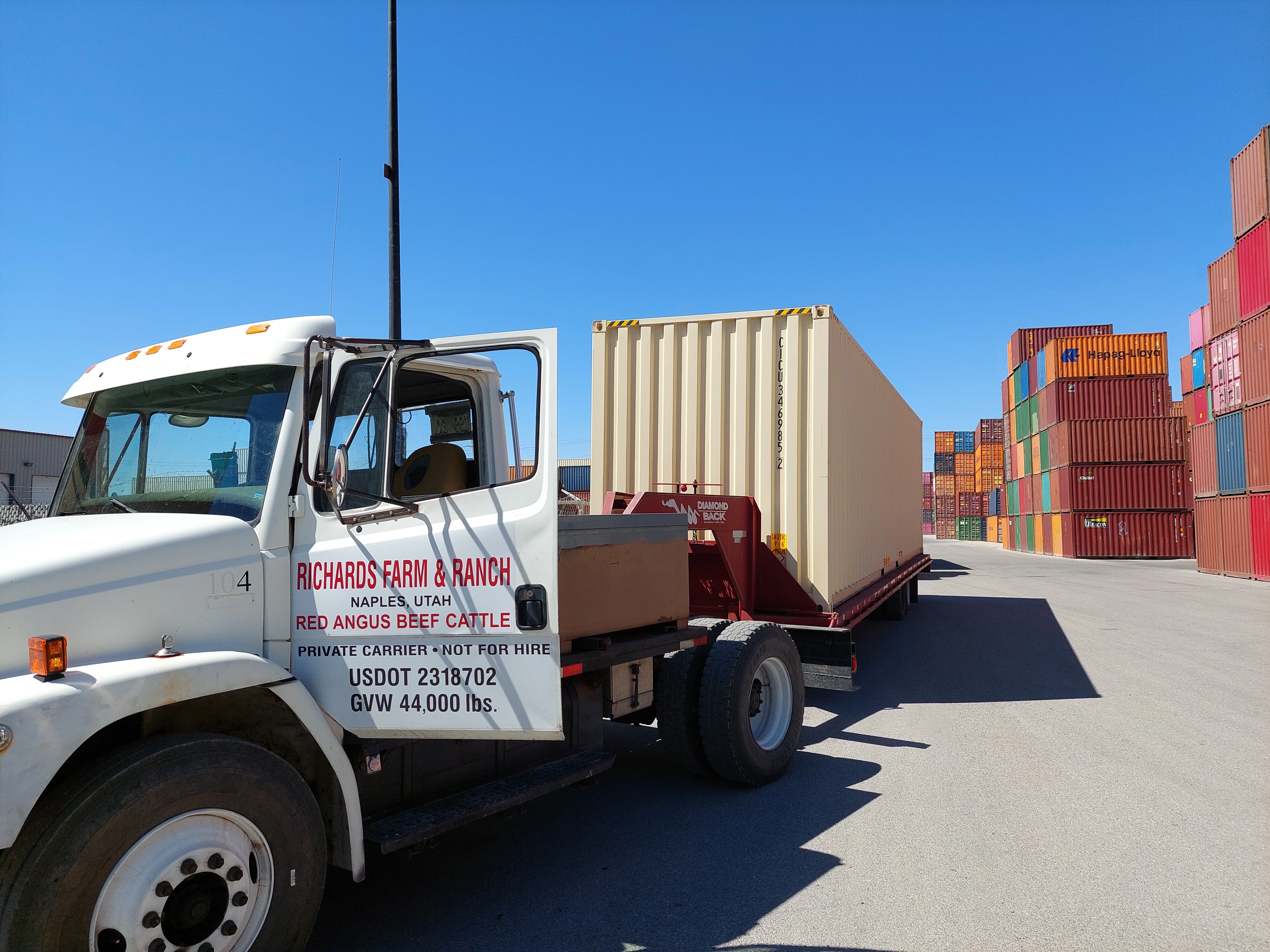 Container being placed at a customer's property in the Uintah Basin